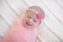 image of smiling newborn baby girl in Ft. Worth Dallas by Sunny Mays Photography