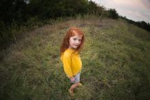 Creative and colorful image of a little girl in a Texas field