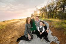 Family near lake during outdoor fall photo shoot in Flower Mound Grapevine Southlake Texas