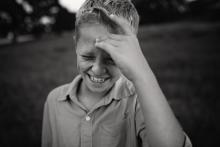 tween boy laughing best tween lifestyle photographer in Dallas Ft. Worth by Sunny Mays