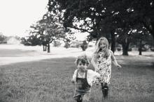 Brother and sister having fun by Texas best fine art portrait photographer