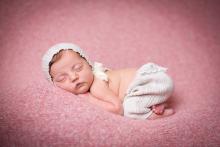 perfectly posed newborn girl on blanket by Sunny Mays Photography