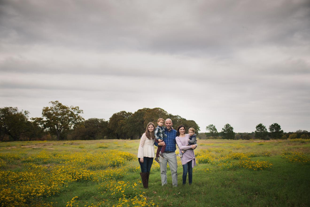 Family in field of wildflowers Dallas- Ft. worth area