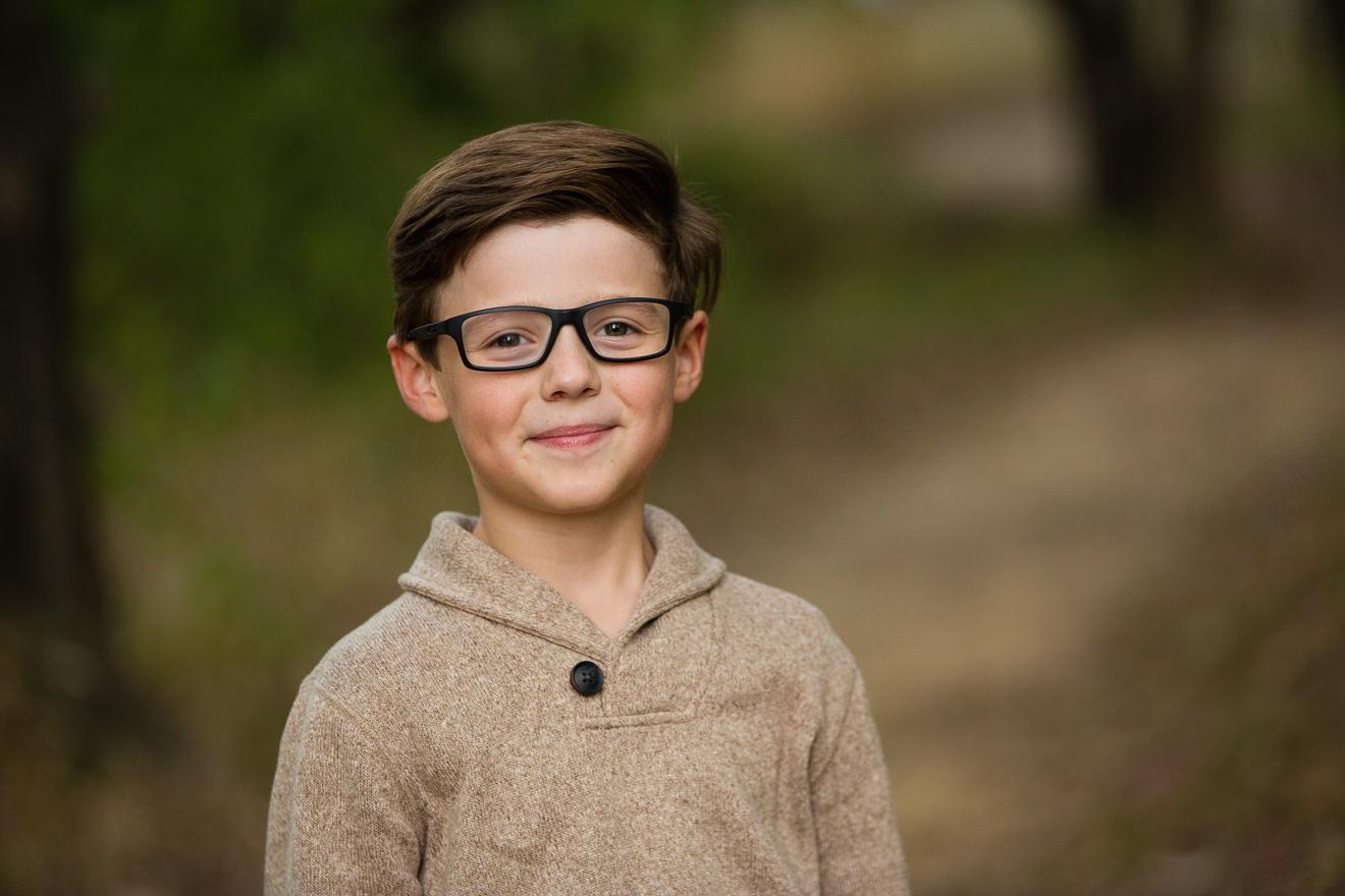 Color image of boy with glasses near Colleyville Texas