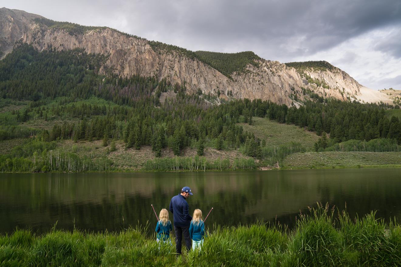 Father fishing with twins in the mountains of Crested Butte by best travel photographer
