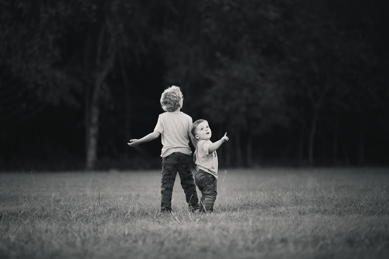 Beautiful black and white image of two brothers in a field near Trophy Club Flower Mound Southlake Dallas Texas