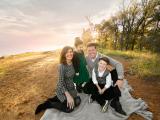 Family near lake during outdoor fall photo shoot in Flower Mound Grapevine Southlake Texas