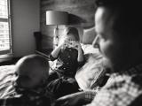 B&W photo of Dad with kids while his daughter takes picture of Sunny Mays