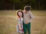 Colorful image of brother and sister in a field in Colleyville Texas
